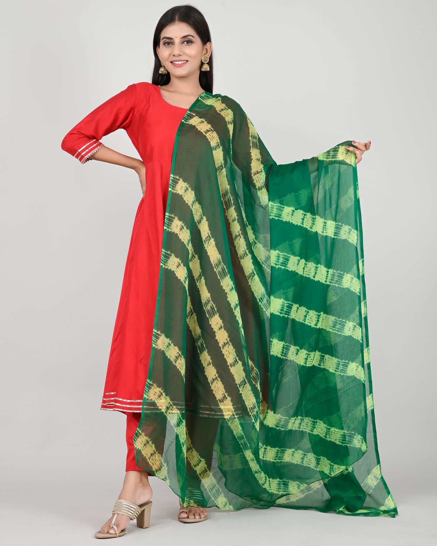 Plain red kurta paired with a contrasting green striped dupatta.