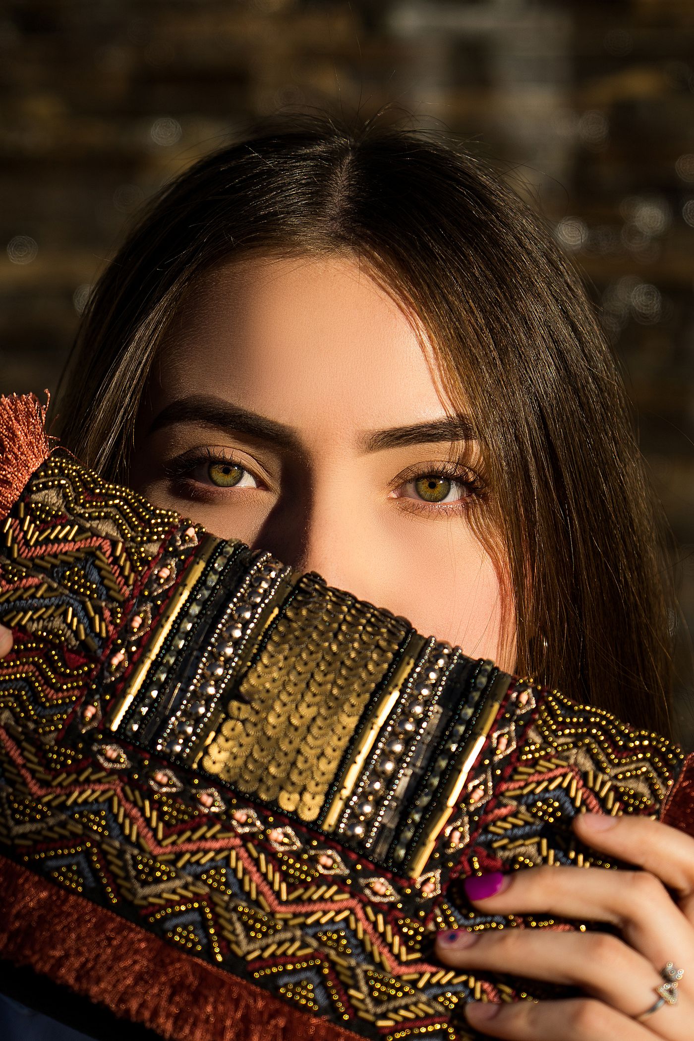 Close view of a richly beaded and embroidered evening clutch.